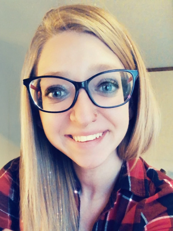 Arlene Harper, owner of Harper's Haven Cleaning, smiling in glasses